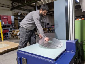 Employee placing disc 1 Closing the sheet metal inspection loop