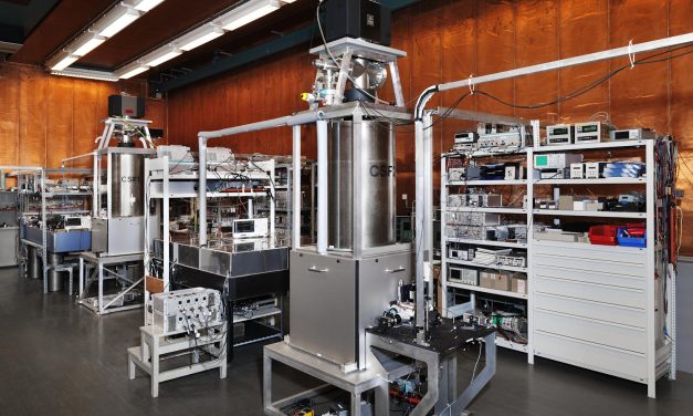 How are atomic clocks refined with AWG cards in PXIe format?